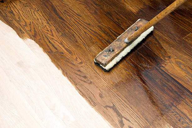istock Dark Stain Application on New Oak Hardwood Floor 184881406