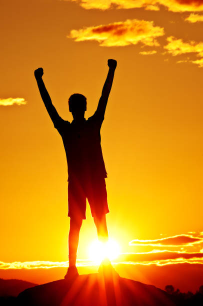 istock Young man with outstretched arms (sunset scenery) - V 184881591