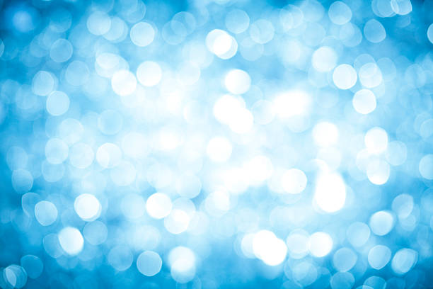 istock Blurred blue sparkles background with darker corners and bright center. 184882086
