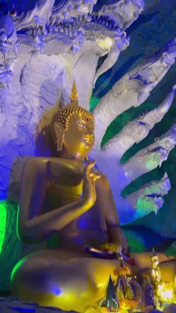 Buddha in the Naga pose in a beautiful cave
