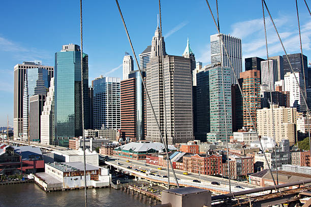 istock Lower Manhattan seen from Brooklyn bridge at sunrise 184882134