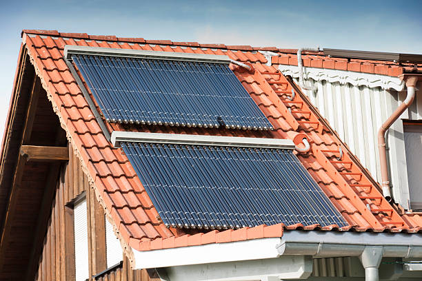 istock Solar water heating panels on a roof 184882173