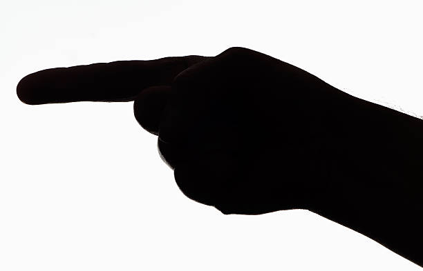 istock Silhouette of human hand pointing with finger 184882538