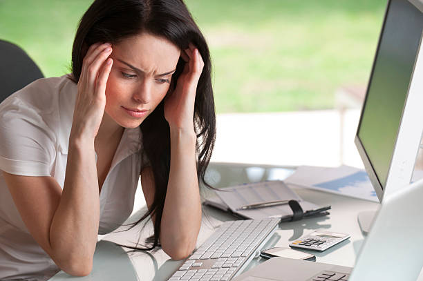 istock Attractive woman holding her head 184882676