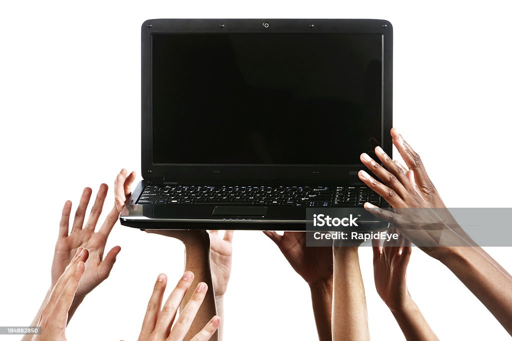 Many hands reaching up for laptop against white "It might be the lure of technology or the need to communicate or simply the urge to check out someone else's facebook page, but this laptop is certainly sought after as many hands grab for it. Isolated against white." Anticipation Stock Photo