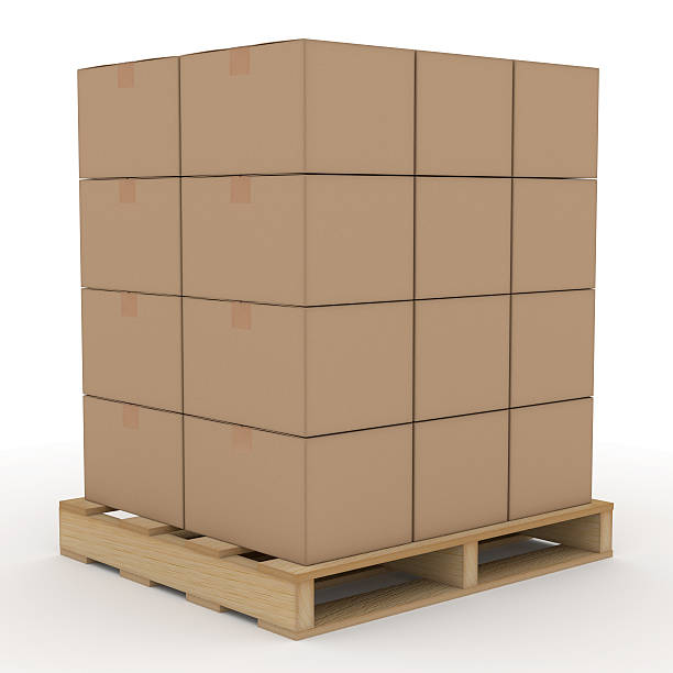 Cardboard boxes on a wooden shipping pallet stock photo
