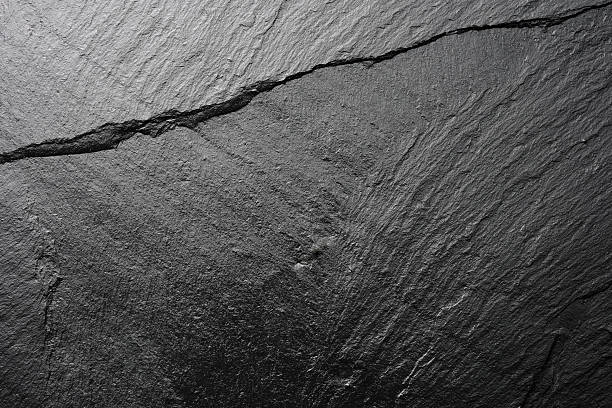 Blank slate textured backgrounds Close-up shot of shiny blank slate textured backgrounds.  slate rock nature stock pictures, royalty-free photos & images