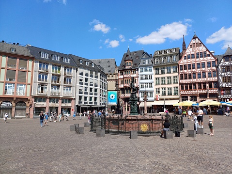 Frankfurt, Germany - June 11, 2023: View of Romerberg square, an old town square  with fountain of justice in Frankfurt city, Germany.