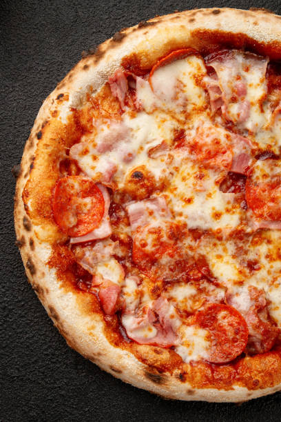 istock Pizza with bell peppers, onions, cheese and sauce 1848834980