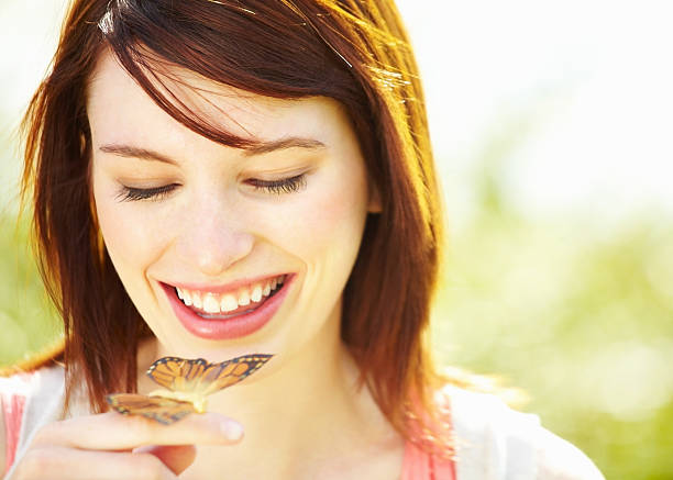 istock Pretty girl with butterfly in a park 184883756