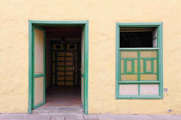 istock door and window in yellow spanish housing facade 184883813