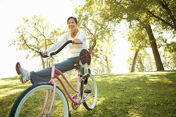 istock Active woman cycling outdoors 184883990