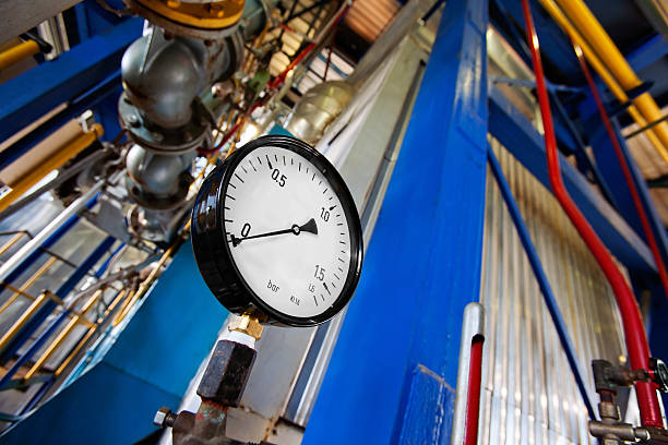 Pressure gauge of an industrial heating system. Oil refinery. The grain and texture added.SEE ALSO: