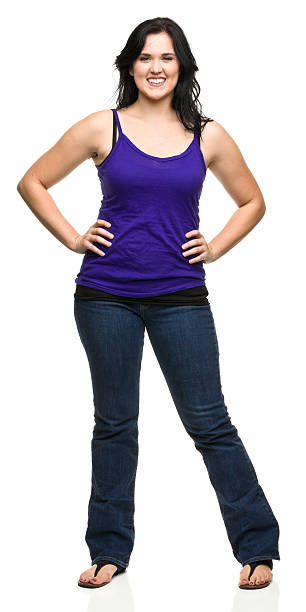Happy Young Woman With Arms Akimbo