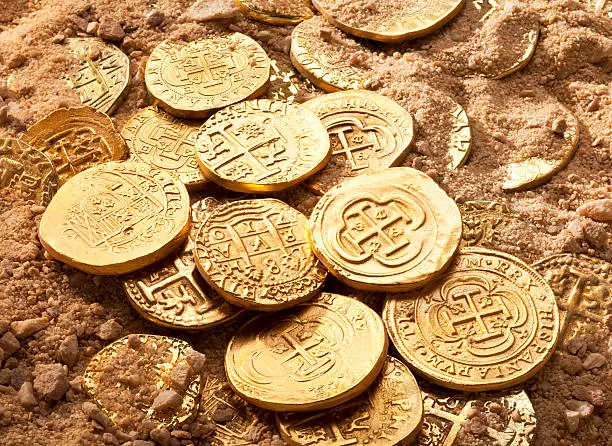Centuries old variety of gold doubloons and gold cobbs.