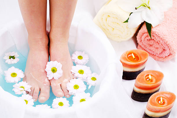 istock Spa treatment.  Legs in blue water 184884919