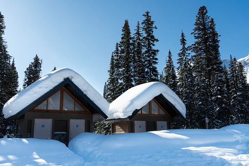 Winter scene of snow topped restrooms at Peyto Lake, Icefields Parkway, Alberta, Canada