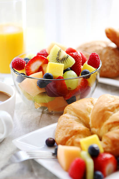 istock breakfast- croissant, fruit salad and coffee 184885602