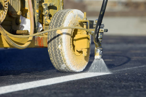 Parking Lot Stripe Painting on New Asphalt  road marking stock pictures, royalty-free photos & images