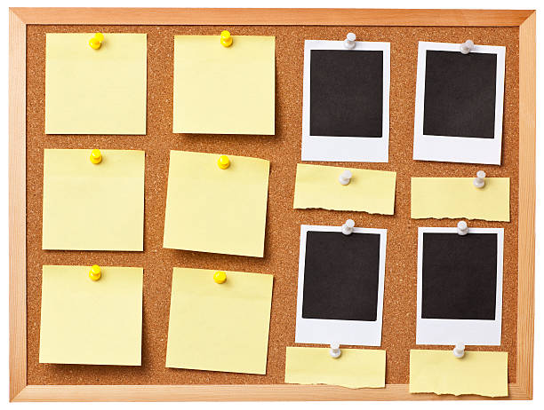 istock Office cork board full of colored memo notes. 184885724