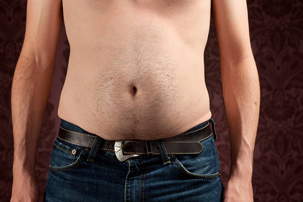 schmale mann mit einer fett bauch - pot belly stock-fotos und bilder
