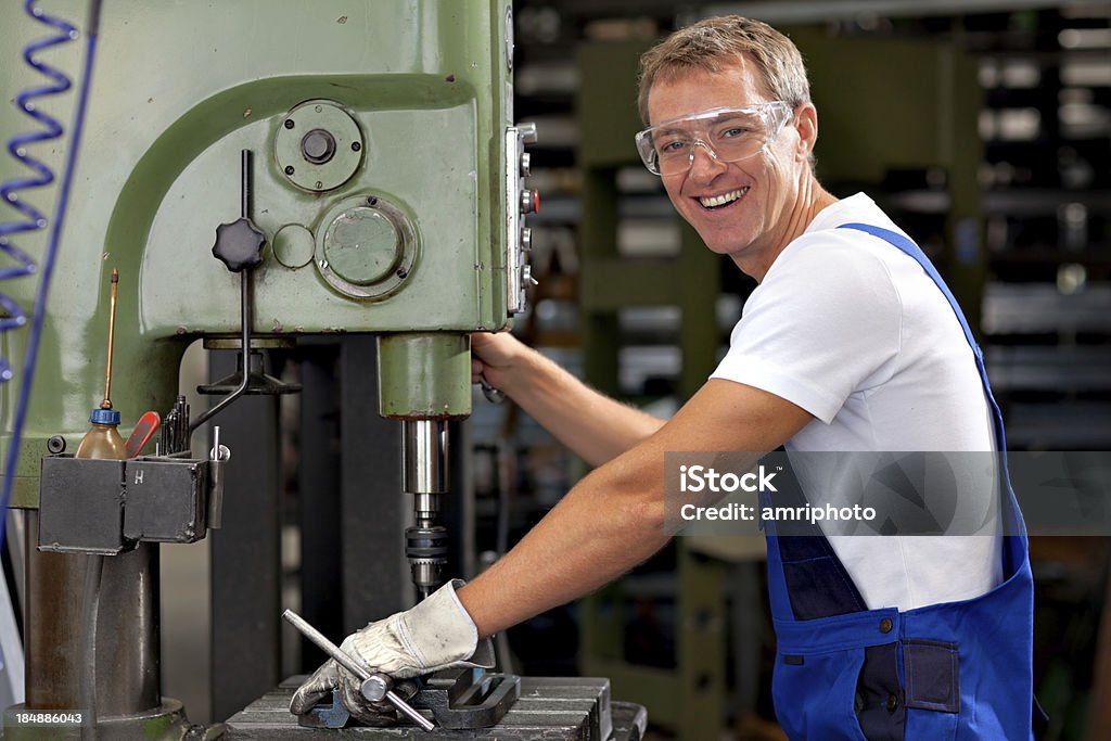 happy industrial worker happy industrial worker with protection goggles during work Adult Stock Photo