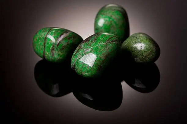 Group of Jade stones over black background