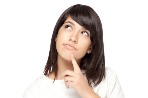 Close-up  portrait of a teenage girl looking up into the corner with finger on chick.