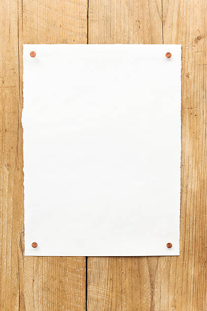 istock Blank paper on wooden wall 184886333