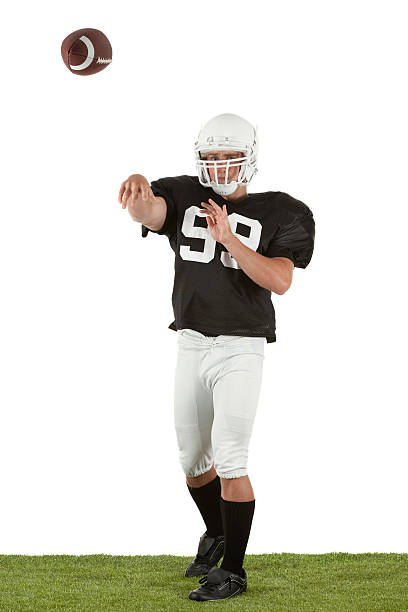 istock American football player throwing a ball 184886677