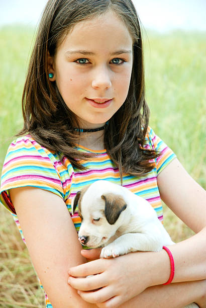 istock Girl and puppy 184886918