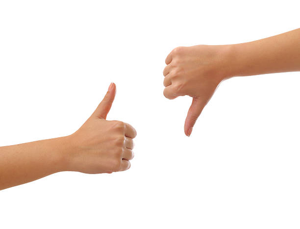 Thumbs up and  down stock photo