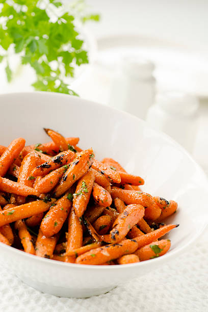 istock Grilled Herbed Baby Carrots Vertical 184887527