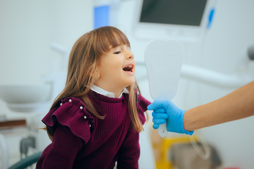 Cheerful toddler enjoying a pediatric dental visit