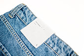 Blank clothing tag on new denim pants. Template for tag or label design