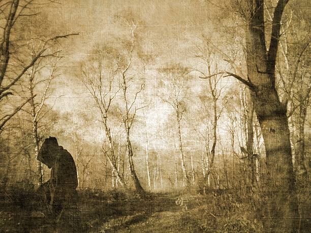 istock Monk figure praying in the forest 184890895