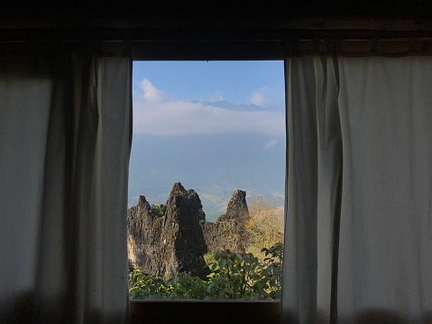 Mountain view window with curtain in Sapa, Vietnam