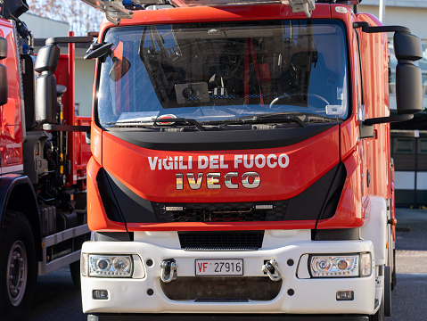 Red fire truck ready to provide first aid in case of emergency. Tank lorry. Italian firefighters or Vigili del fuoco