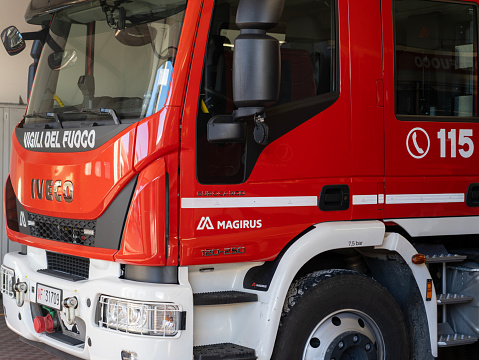 Red fire truck ready to provide first aid in case of emergency. Tank lorry. Italian firefighters or Vigili del fuoco