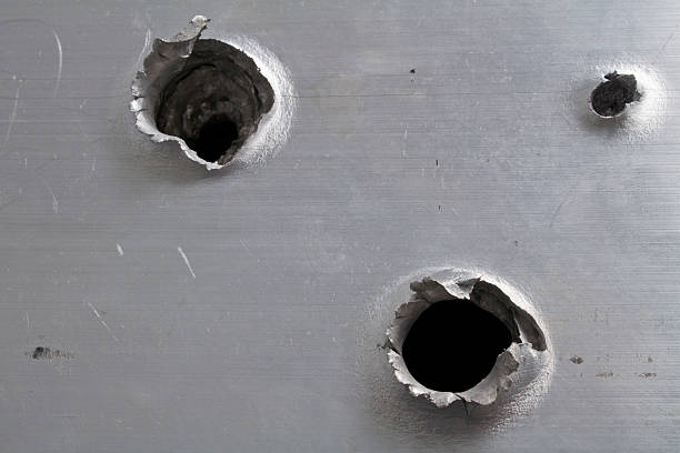 istock Bullet Holes in Aluminum 184896426
