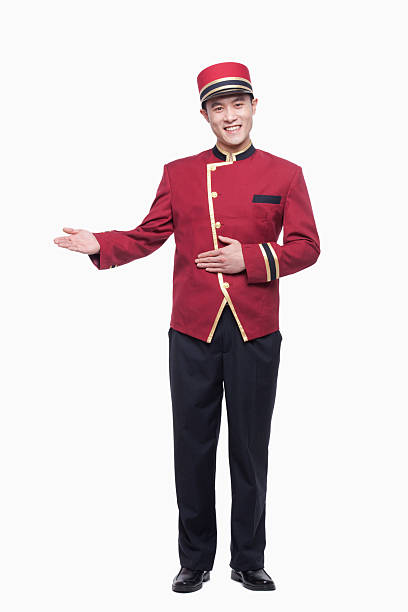 Portrait of Bellhop, Greeting, studio shot Portrait of Bellhop, Greeting, studio shot bellhop stock pictures, royalty-free photos & images