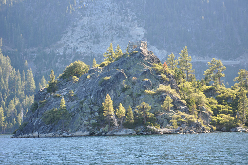 View of the ruins of the tea house on Fannette Island at Emerald Bay in Lake Tahoe, California, from a boat on a sunny day