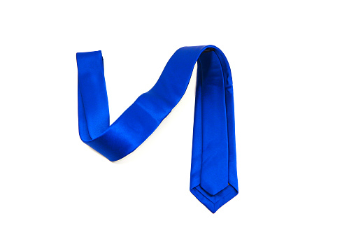 Blue coloured polyester fabric necktie isolated on white background close-up view single object concept no people
