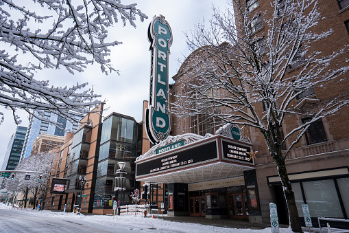 Portland, OR, USA - Feb 23, 2023: Front view of the Arlene Schnitzer Concert Hall, a historic and iconic theater building and performing arts center in downtown Portland, Oregon, after heavy snowfall.