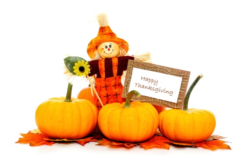 Happy Thanksgiving card with scarecrow and pumpkins