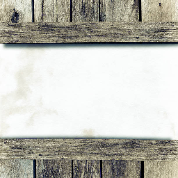 istock Paper sheet in middle of wood texture 184901425