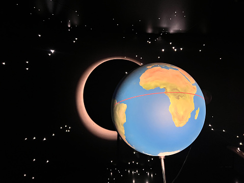 Lunar eclipse model over Africa continent on dark outer space background.