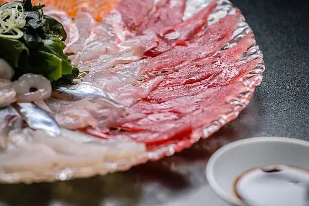 Sashimi plate with tuna fish,swordfish,shrimps, prawns,salmon,octopus,sardines and origami