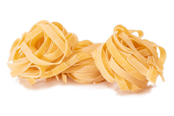 istock Three Classic Italian Raw Egg Fettuccine - Isolated on White Background 1849030063