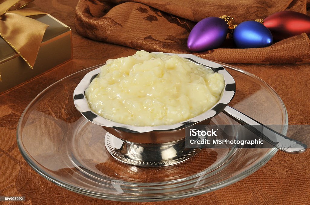 Tapioca pudding at Christmas A silver dessert cup of tapioca pudding on a Christmas dinner table Bowl Stock Photo